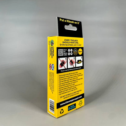 Yellow and black Kibosh packaging box on a grey background