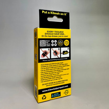 Yellow and black Kibosh packaging box with text and QR code on a grey background